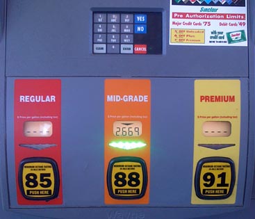 Gas pump interface showing the grade sticker that also functions as the start button